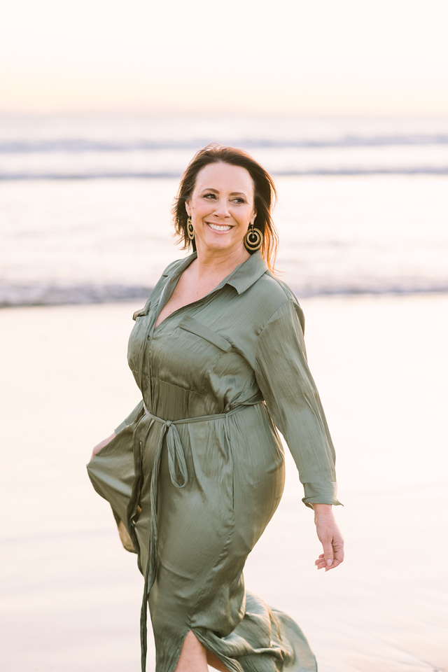 Christina L. Woods smiling on the beach